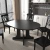 Dining Table for Farmhouse Kitchen 59x43 Inch Expandable Oval Table Top with Removable Leaf Trestle X Shaped Base Black